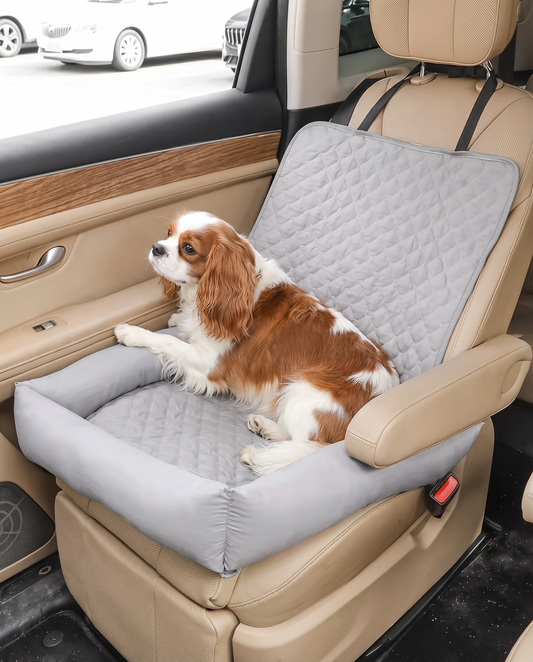 Charcoal gray waterproof quilted pet car seat nest with supportive walls on a passenger bucket seat.